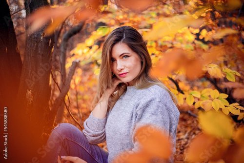 Beautiful woman in autumn park