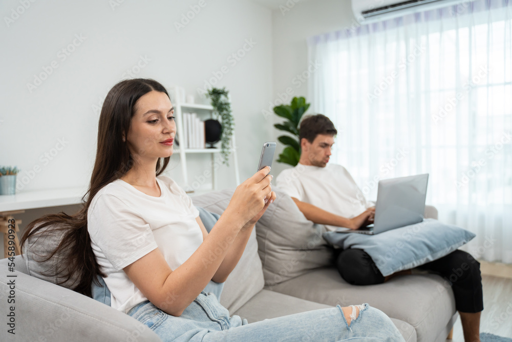 Caucasian phone addict couple don't pay attention with each other. Caucasian phone addict couple don't pay attention with each other.
