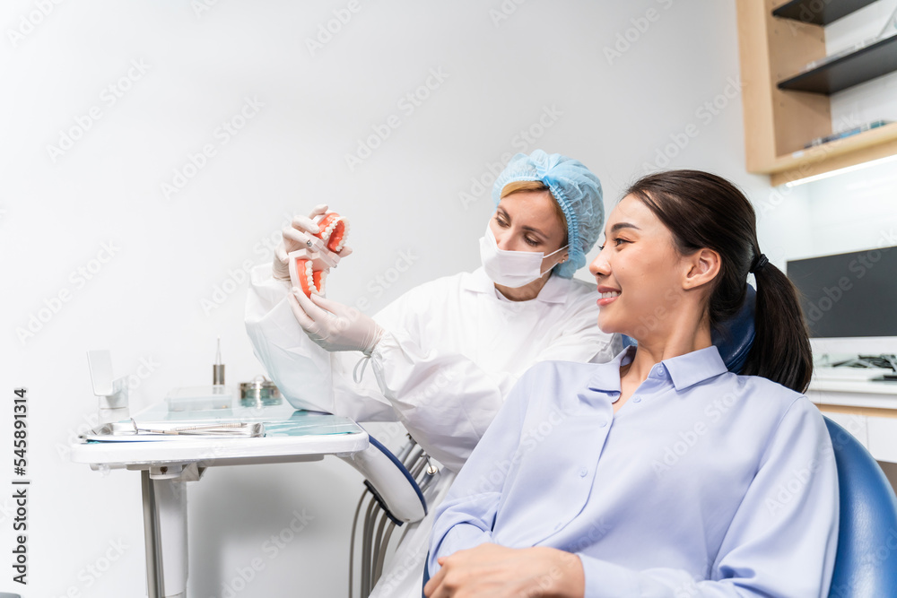 Caucasian dentist examine tooth for young girl at dental health clinic. Caucasian dentist examine tooth for young girl at dental health clinic.