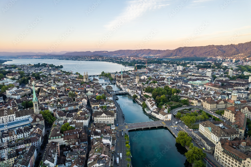 Aerial drone shot flying above Lake Zurich, Switzerland in sunny day. 