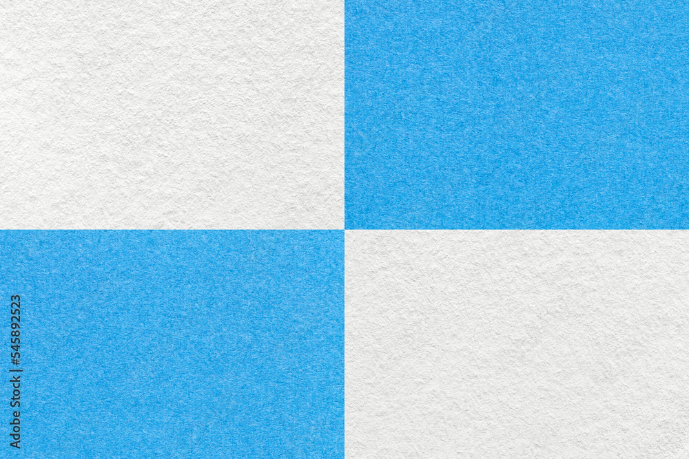 Texture of craft white and light blue paper background with cells pattern. Vintage kraft cerulean cardboard. Texture of craft white and light blue paper background with cells pattern. Vintage kraft cerulean cardboard.