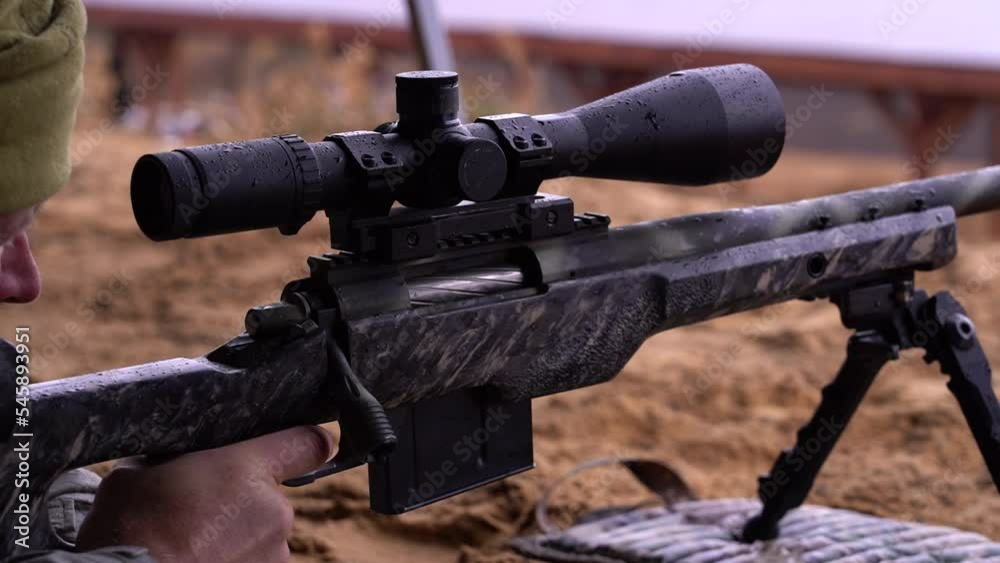 a sniper rifle shot at an object and reloading a sniper rifle shot at an object and reloading