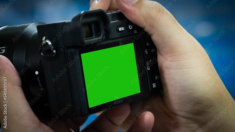 Camera with green screen on the background. Stock Photo | Adobe Stock