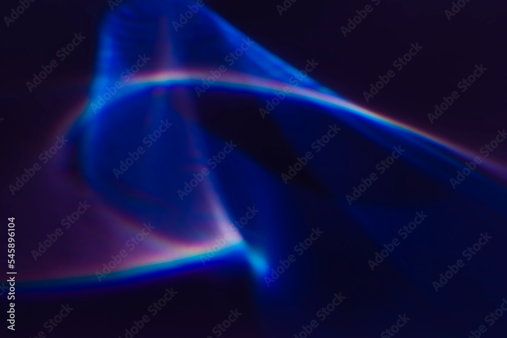 Colorful blue purple rainbow light leaks texture on black background. Defocused abstract dreamy aura, surreal retro film analog screen effect, futuristic nightclub, disco neon laser light overlay