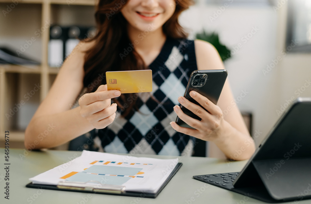 Business woman hands using smartphone and holding credit card as Online shopping . Business woman hands using smartphone and holding credit card as Online shopping .
