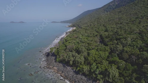 Turquoise Ocean And Lush Rainforest At Borderline Beach In Wangetti, QLD, Australia - aerial drone shot photo