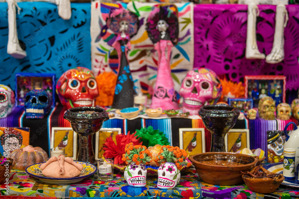 Traditional Dia De Los Muertos Altar. Mexico's Day of the Dead. Painted sugar skulls, candles, skeletons and other decoration. Belgrade, Serbia 01.11.2022