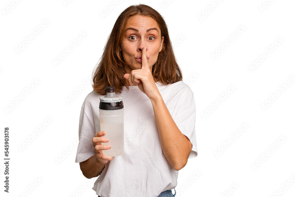 Young caucasian sport woman holding a bottle of water isolated keeping a secret or asking for silence. Young caucasian sport woman holding a bottle of water isolated keeping a secret or asking for silence.