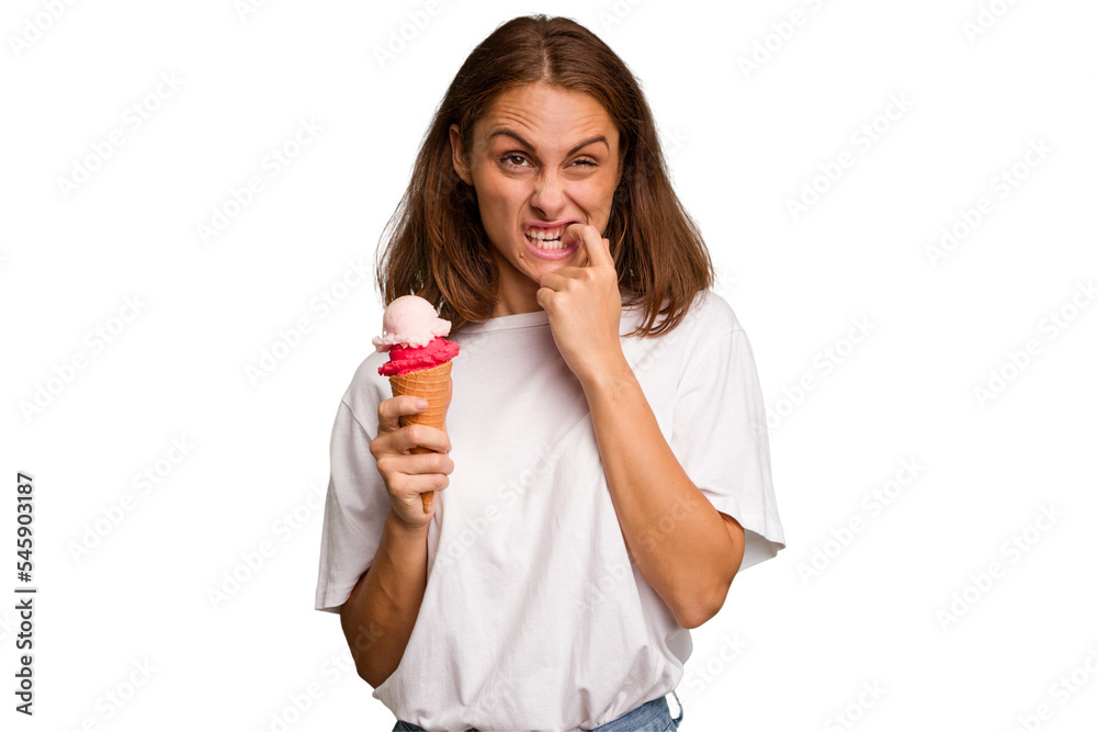 Young caucasian woman holding an ice cream isolated relaxed thinking about something looking at a copy space. Young caucasian woman holding an ice cream isolated relaxed thinking about something looking at a copy space.