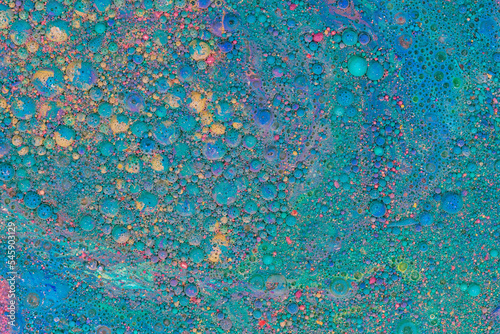 Multicolored paints create a beautiful abstract background