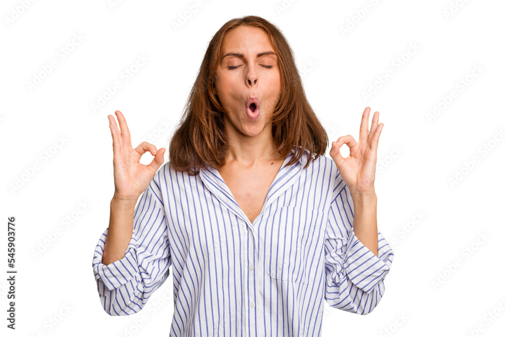 Young caucasian woman isolated relaxes after hard working day, she is performing yoga. Young caucasian woman isolated relaxes after hard working day, she is performing yoga.