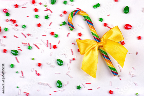 Christmas background of colorful candies, lollipop cane on a white background, close-up