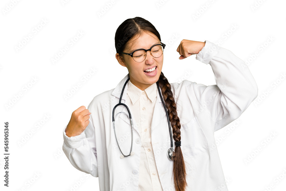 Young doctor asian woman isolated raising fist after a victory, winner concept. Young doctor asian woman isolated raising fist after a victory, winner concept.