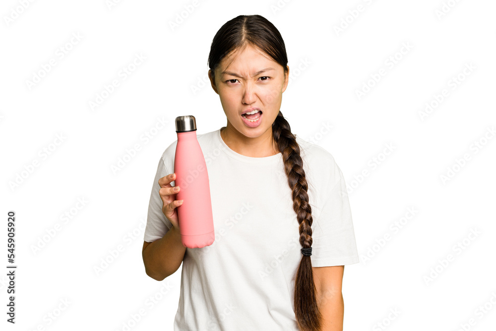 Young asian woman holding a pink thermo isolated screaming very angry and aggressive. Young asian woman holding a pink thermo isolated screaming very angry and aggressive.