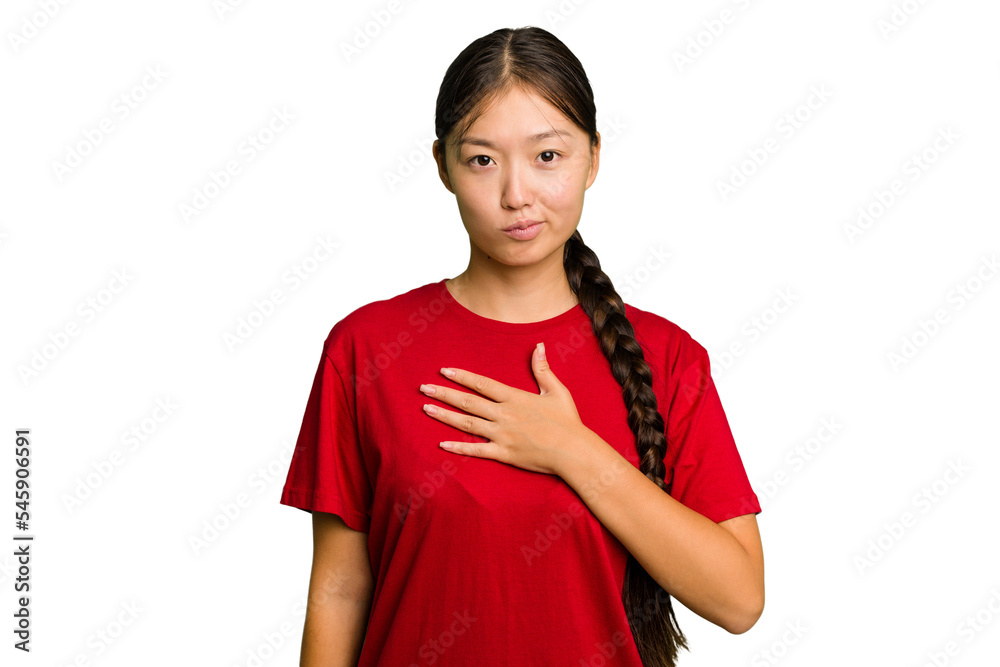 Young Asian woman isolated taking an oath, putting hand on chest. Young Asian woman isolated taking an oath, putting hand on chest.