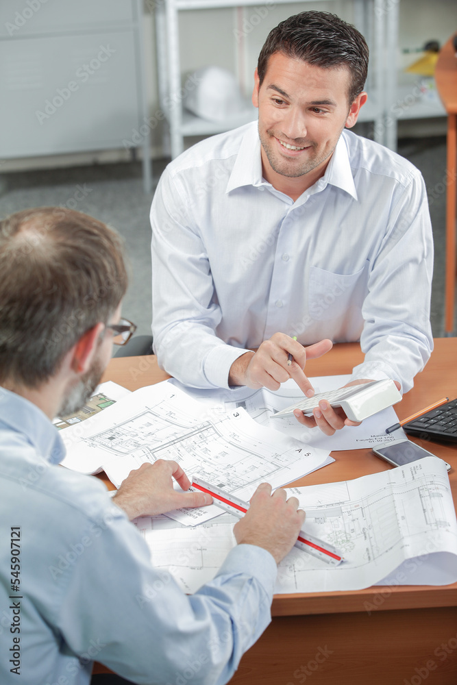 two men in office during meeting two men in office during meeting