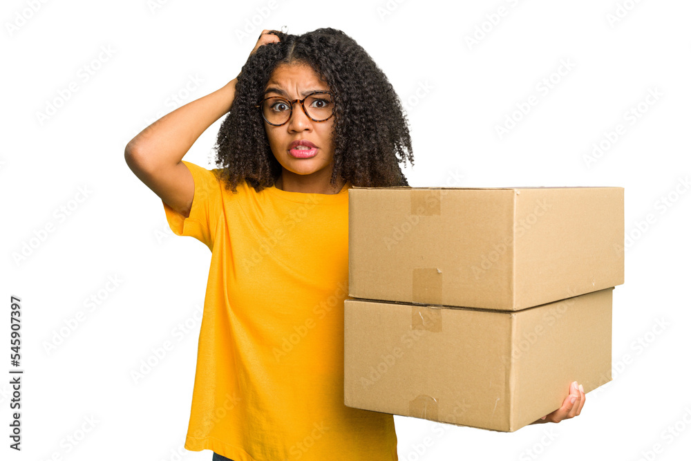 Young african american woman moving to other house while picking up a box full of things isolated being shocked, she has remembered important meeting. Young african american woman moving to other house while picking up a box full of things isolated being shocked, she has remembered important meeting.