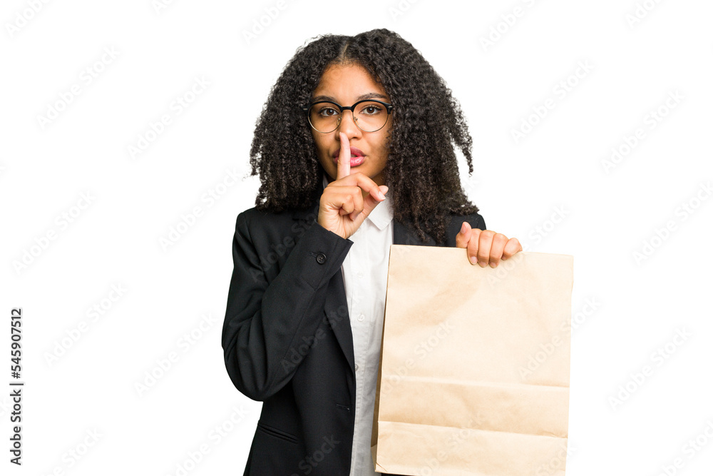 Young african american business woman holding a take away bag isolated keeping a secret or asking for silence. Young african american business woman holding a take away bag isolated keeping a secret or asking for silence.