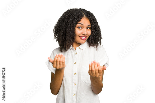 Young african american woman isolated pointing with finger at you as if inviting come closer.