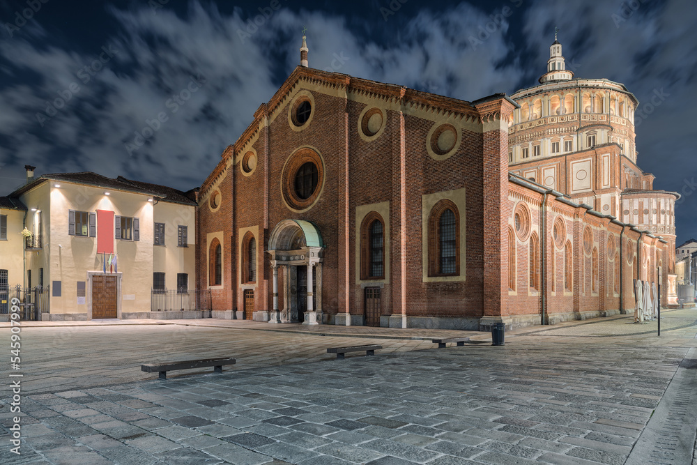 Fototapeta premium Milan city at night. Basilica Santa Maria delle Grazie famous for hosting Leonardo da Vinci masterpiece 