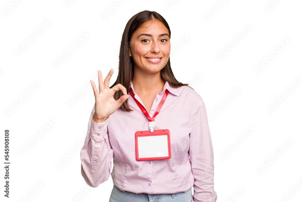 Young caucasian woman with a badge isolated cheerful and confident showing ok gesture. Young caucasian woman with a badge isolated cheerful and confident showing ok gesture.