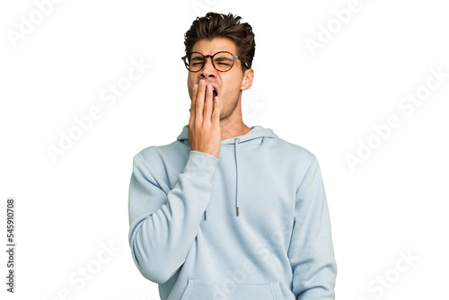 Young caucasian handsome man isolated yawning showing a tired gesture covering mouth with hand. photo