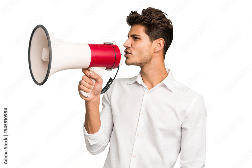 Young caucasian man screaming with a megaphone isolated