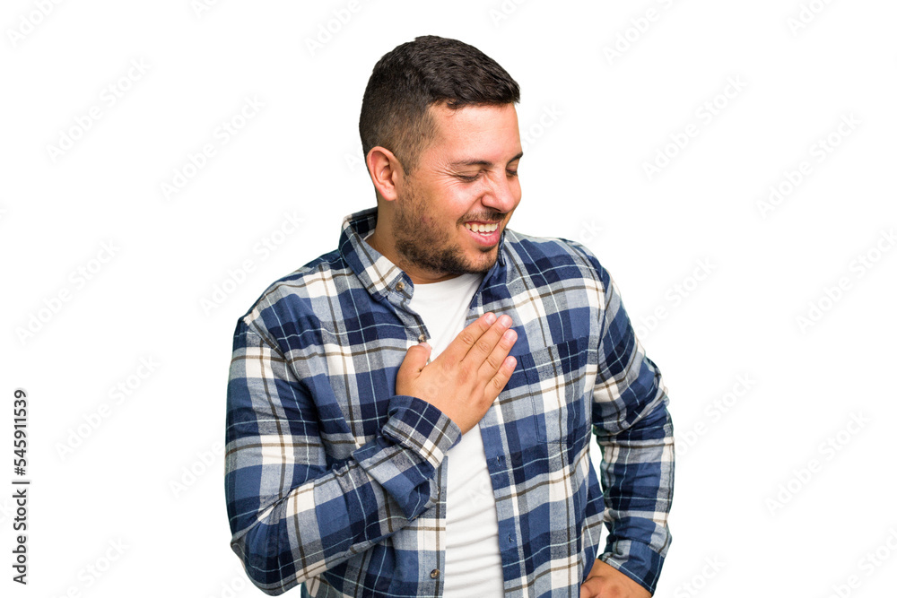 Young caucasian man isolated laughing keeping hands on heart, concept of happiness. Young caucasian man isolated laughing keeping hands on heart, concept of happiness.