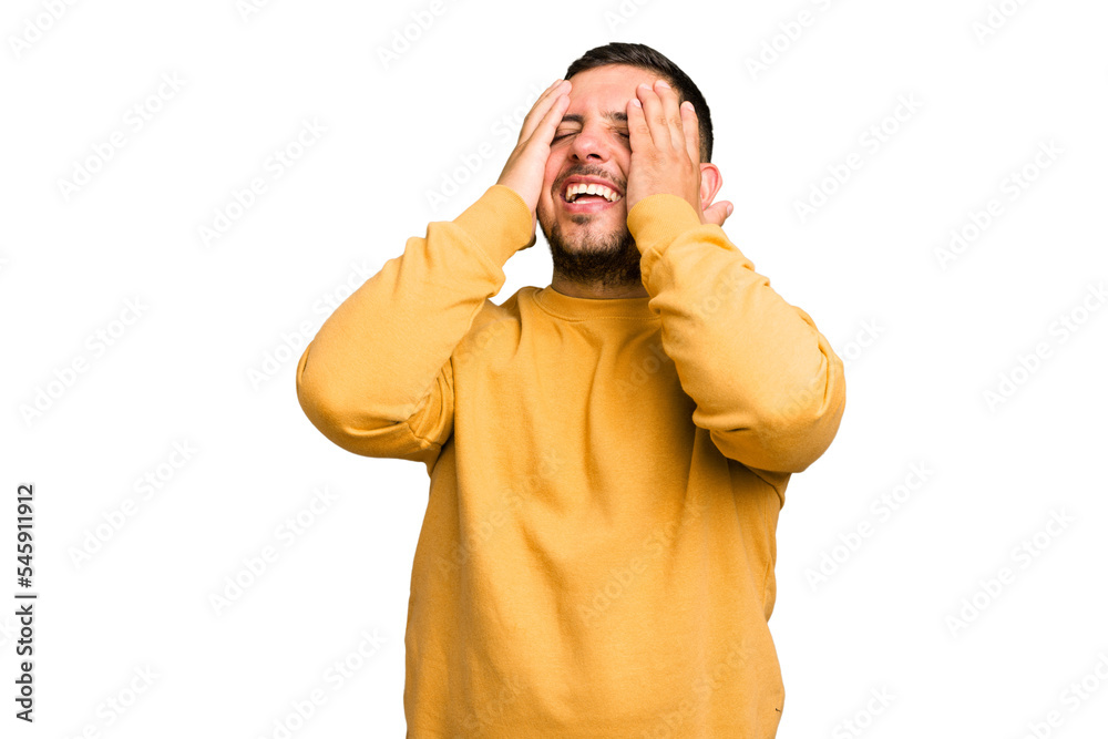 Young caucasian man isolated laughs joyfully keeping hands on head. Happiness concept. Young caucasian man isolated laughs joyfully keeping hands on head. Happiness concept.