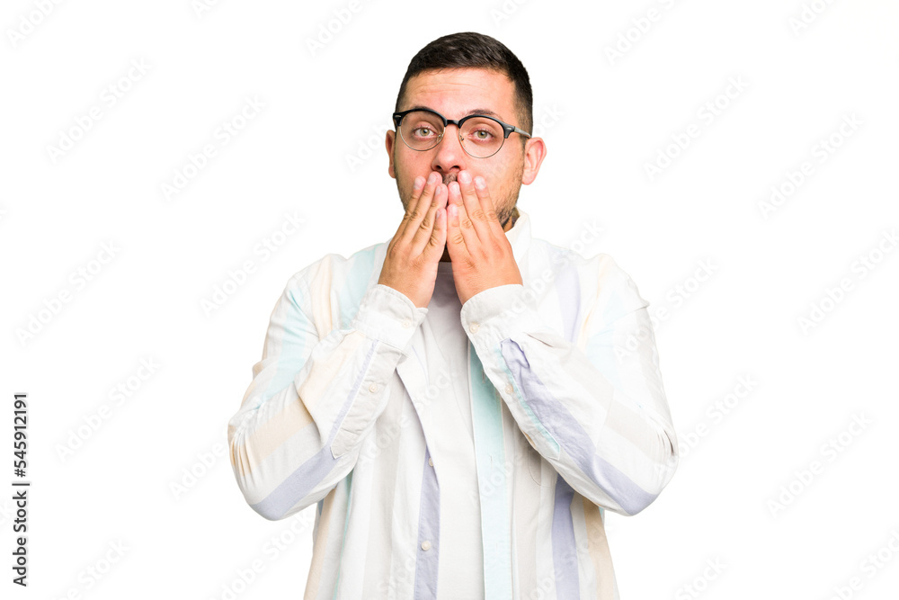 Young caucasian man isolated shocked covering mouth with hands. Young caucasian man isolated shocked covering mouth with hands.