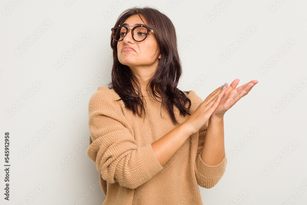 Young Indian woman isolated on white background feeling energetic and comfortable, rubbing hands confident. Young Indian woman isolated on white background feeling energetic and comfortable, rubbing hands confident.