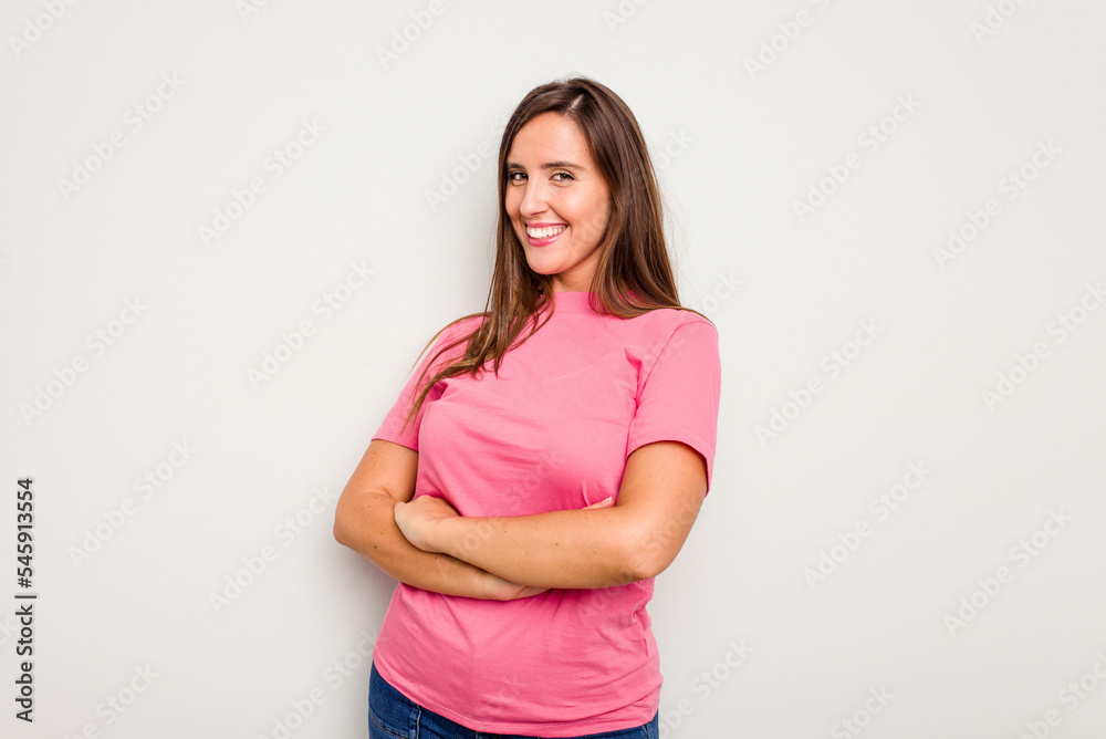 Young caucasian cute woman isolated on white background who feels confident, crossing arms with determination. Young caucasian cute woman isolated on white background who feels confident, crossing arms with determination.