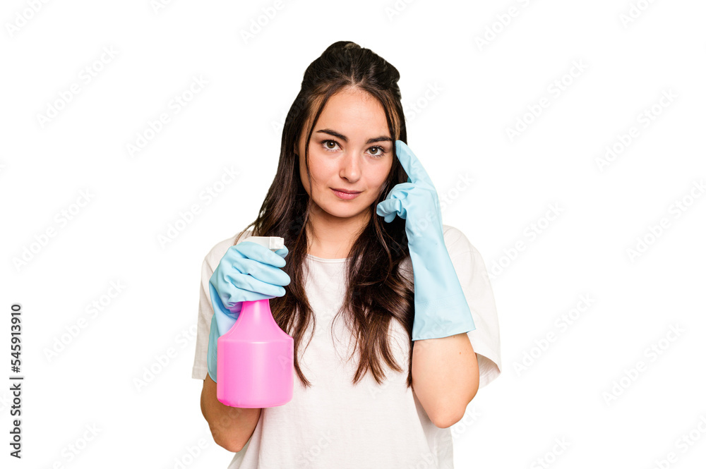 Young cleaner caucasian woman isolated on green chroma background pointing temple with finger, thinking, focused on a task. Young cleaner caucasian woman isolated on green chroma background pointing temple with finger, thinking, focused on a task.
