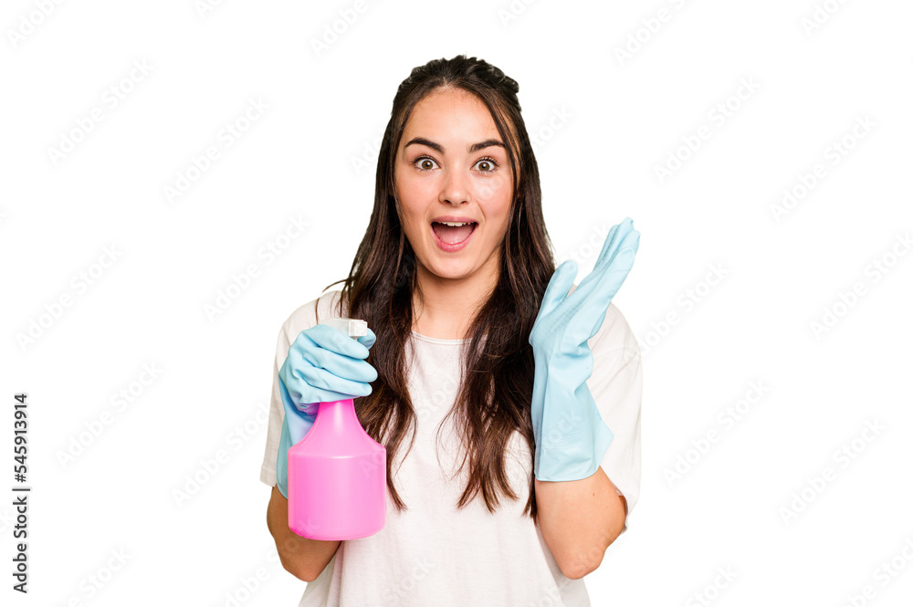 Young cleaner caucasian woman isolated on green chroma background surprised and shocked. Young cleaner caucasian woman isolated on green chroma background surprised and shocked.