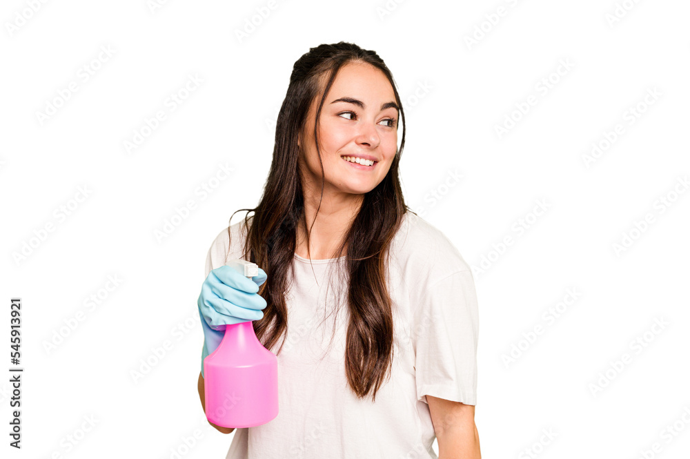 Young cleaner caucasian woman isolated on green chroma background looks aside smiling, cheerful and pleasant. Young cleaner caucasian woman isolated on green chroma background looks aside smiling, cheerful and pleasant.