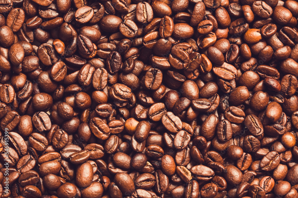Naklejka premium Roasted coffee beans background 