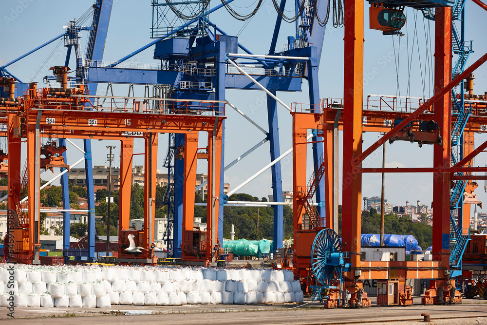 Cranes at comercial seaport. Bosphorus strait in Istanbul. Transportation Turkey