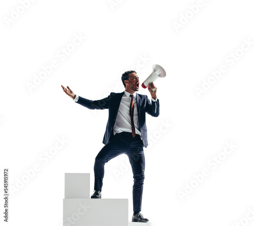 Victorious businessman shouting with a megaphone on a transparent background photo