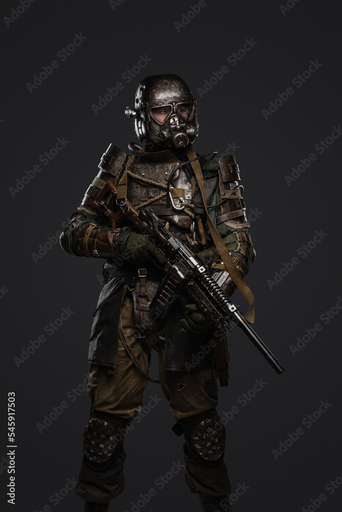 Portrait of soldier survived after atomic catastrophe with gas mask and shotgun. Portrait of soldier survived after atomic catastrophe with gas mask and shotgun.