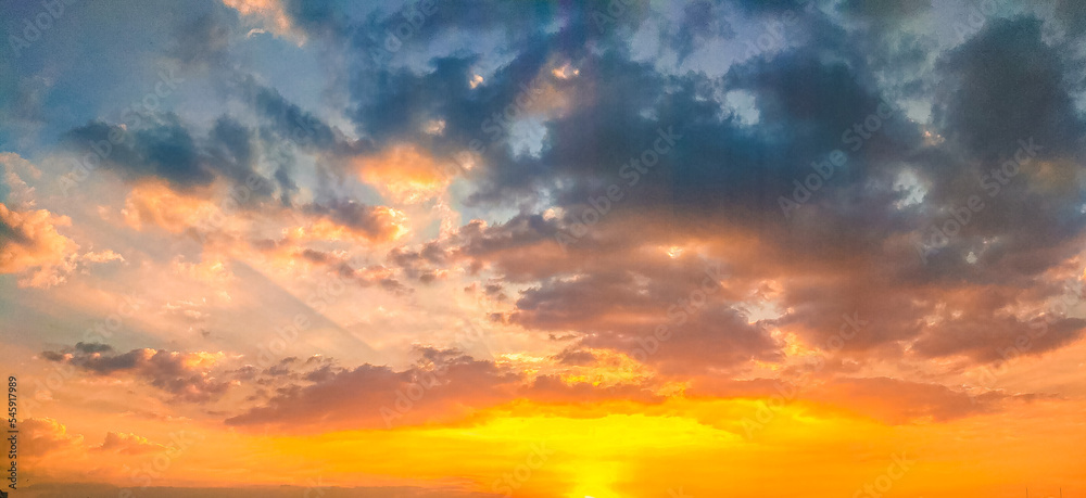 Storm on the Horizon: The Dramatic Aura of an Orange-Dark Sunset Sky