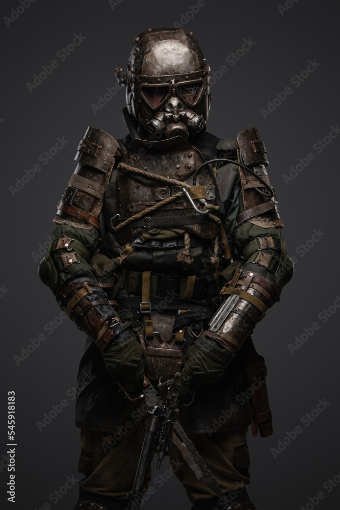 Shot of isolated on grey background soldier in setting of post apocalypse looking at camera. Shot of isolated on grey background soldier in setting of post apocalypse looking at camera.