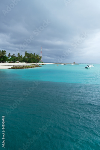 Beautiful beach of Fulidhoo, Maldives during raining season, with gloomy weather. photo