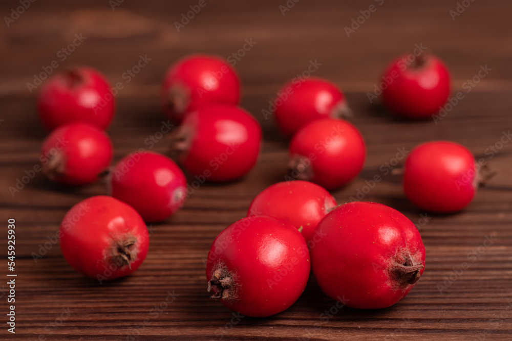 Hawthorn fruits on wooden backgrounds. close up
