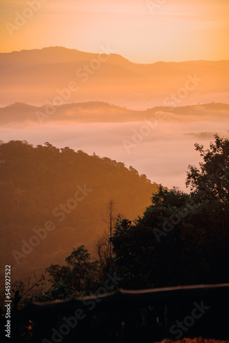 sunrise over a misty sea