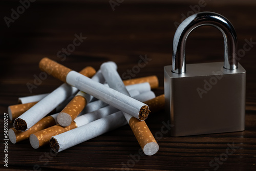 Cigarettes with padlock. Concept stop smoking close up