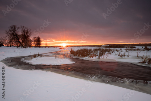 landscape - river covered with snow in winter
