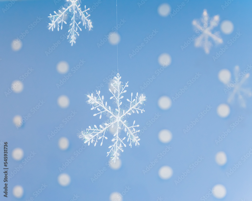 hanging Christmas decoration in the form of delicate snowflakes in the frost