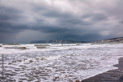 Photography Surfing in the stormy waters at high tide at Compton Bay Isle of Wight south eas