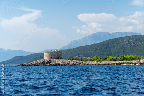 Mamula or Lastavica, uninhabited islet in Adriatic Sea, Montenegro, near of Herceg Novi. Mamula is peninsulas at entrance to the Bay of Kotor. Small island is of circular shape photo