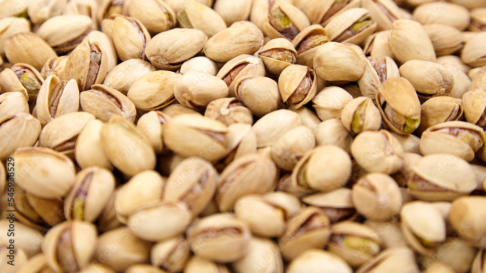 Pistachios as food background. Pistachio nuts, soft focus